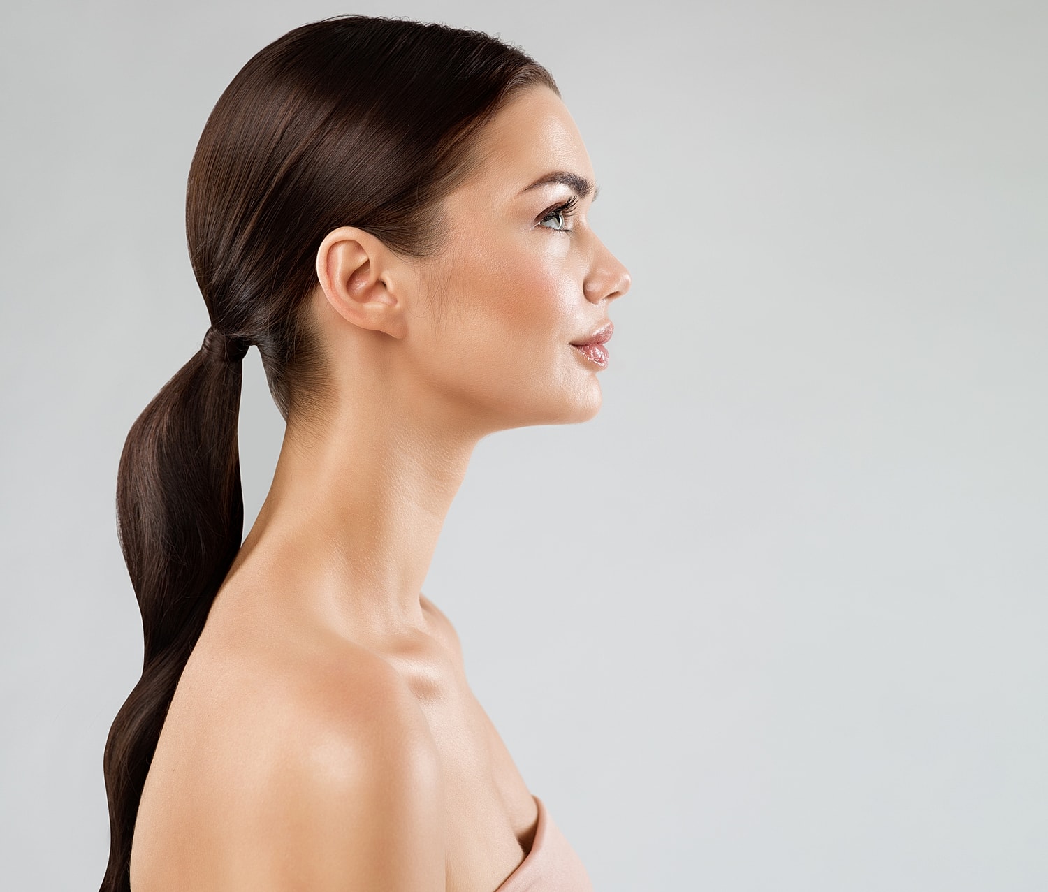 Side profile of a woman with long hair.