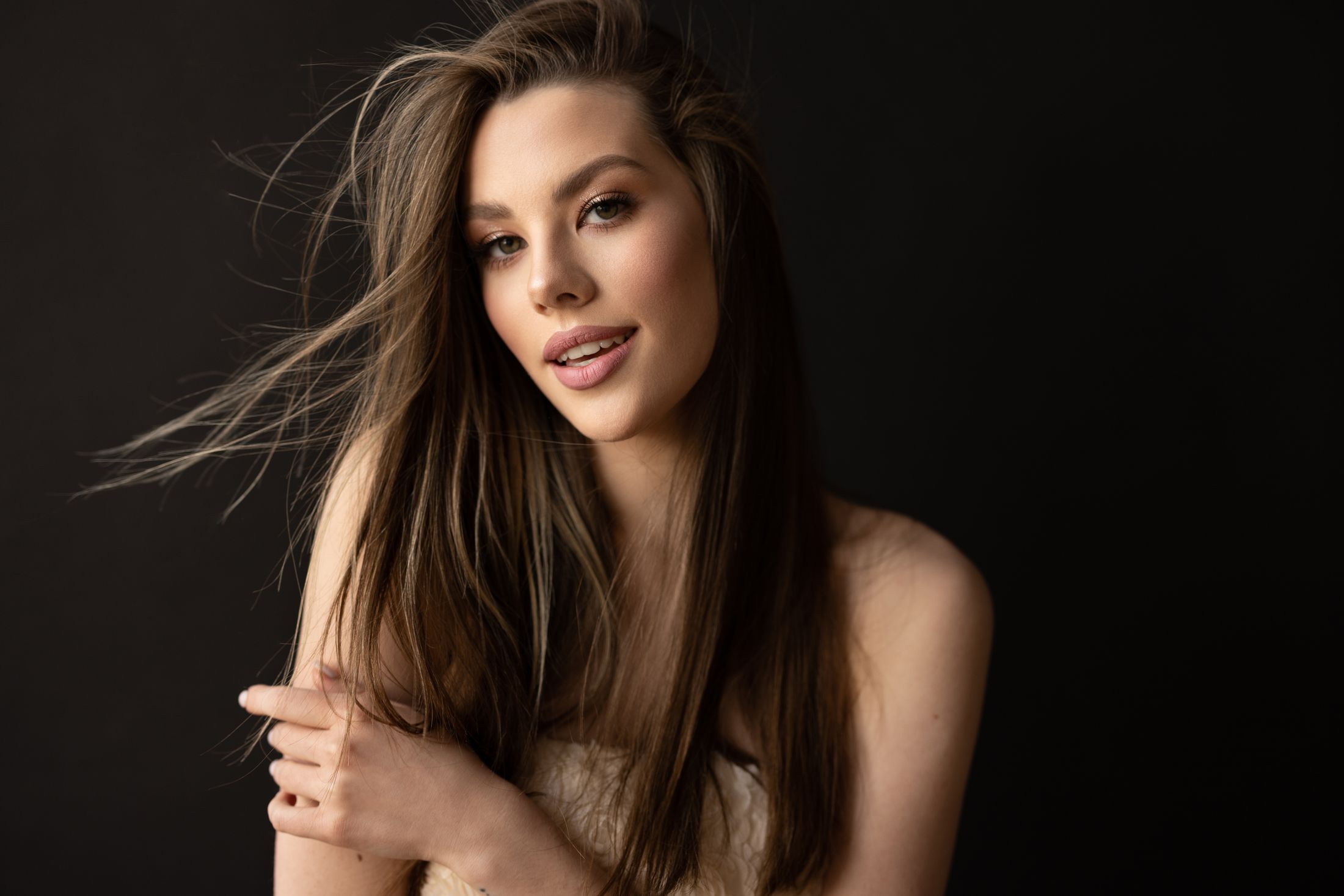 Portrait of a woman with flowing hair.