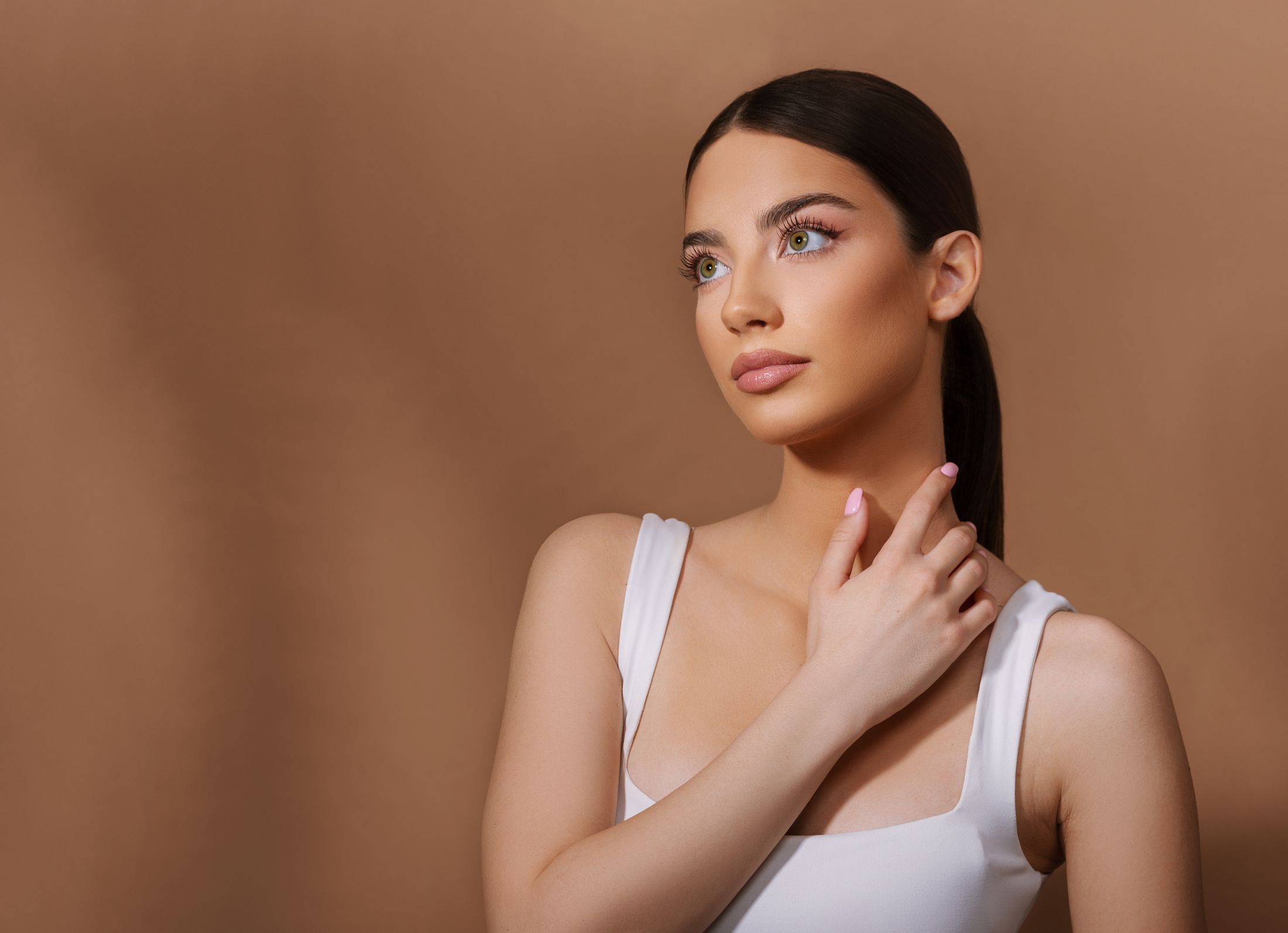 Woman with long hair and striking green eyes.